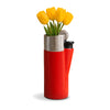 A novelty vase shaped like a red lighter with a silver metallic top and a black nozzle, holding yellow tulips against a white background.