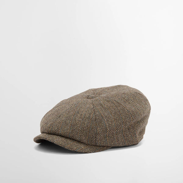 Brown flat cap on a light gray background