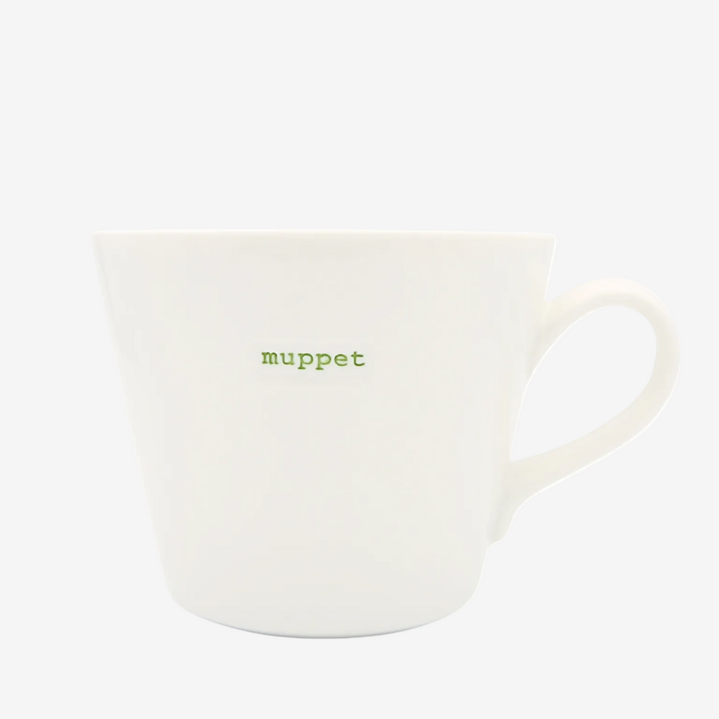 White mug with 'muppet' text on a white background