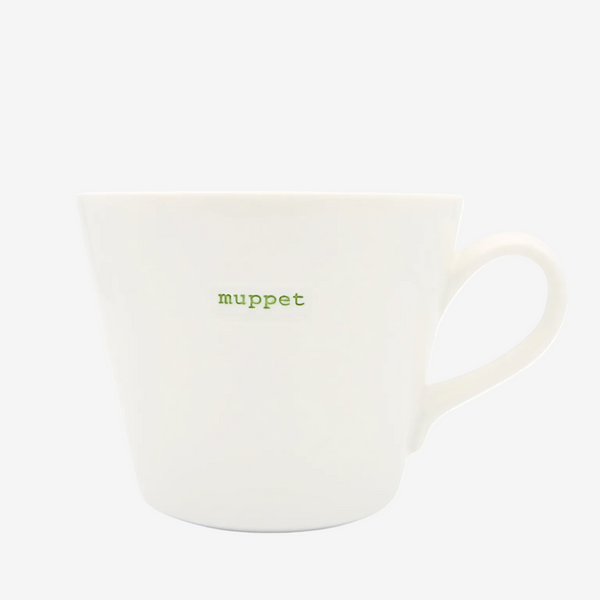 White mug with 'muppet' text on a white background
