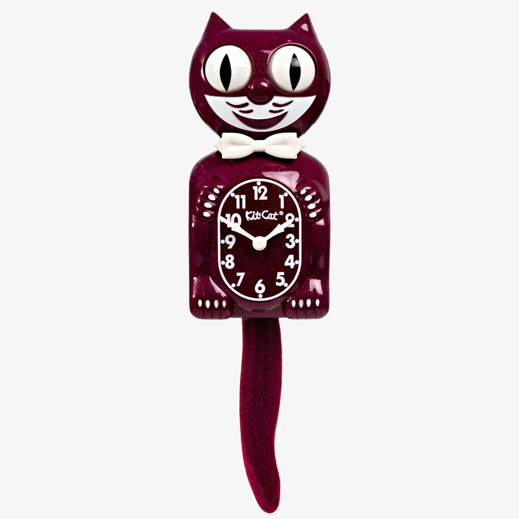 Cat-shaped clock with a red body and white face on a white background